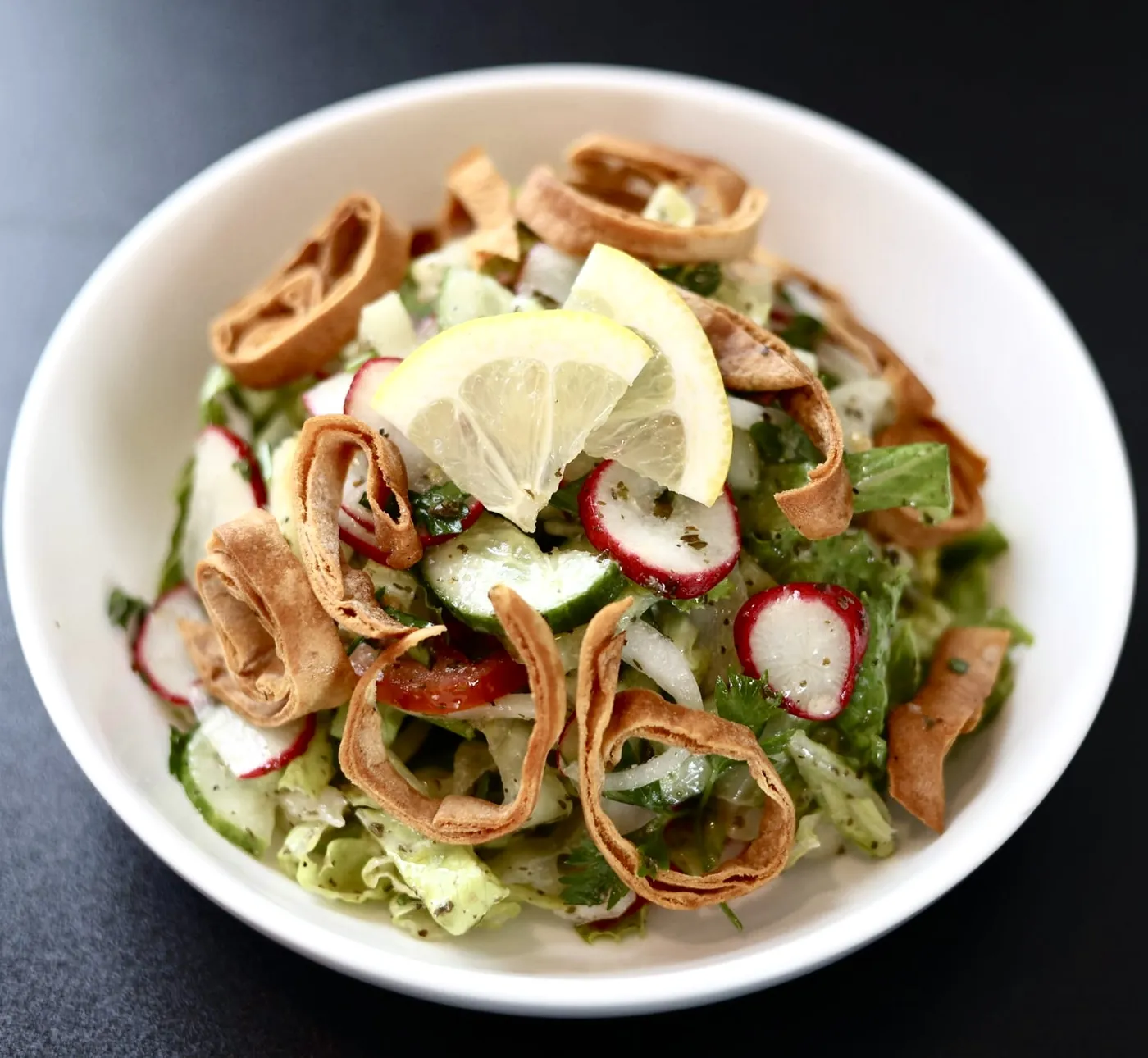 Fattoush salad with toasted pita, radish, cucumber, lemon and garden greens at Leymoon Kitchen