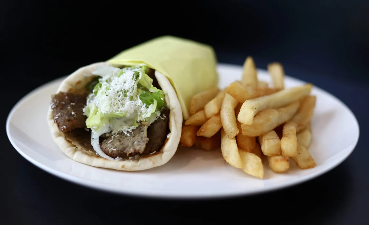 Gyro wrap with lettuce and feta in Greek pita, served with fries at Leymoon Kitchen